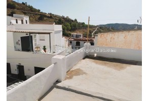 townhouse with 2 entrances in lower part of village